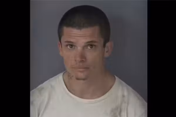 Florida crook accused of ditching stolen car, hiding from cops in home's garage. But homeowner has a gun.