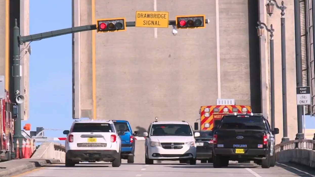 Florida cyclist falls more than 50 feet to her death from rising drawbridge after bystander tried to save her but lost his grip
