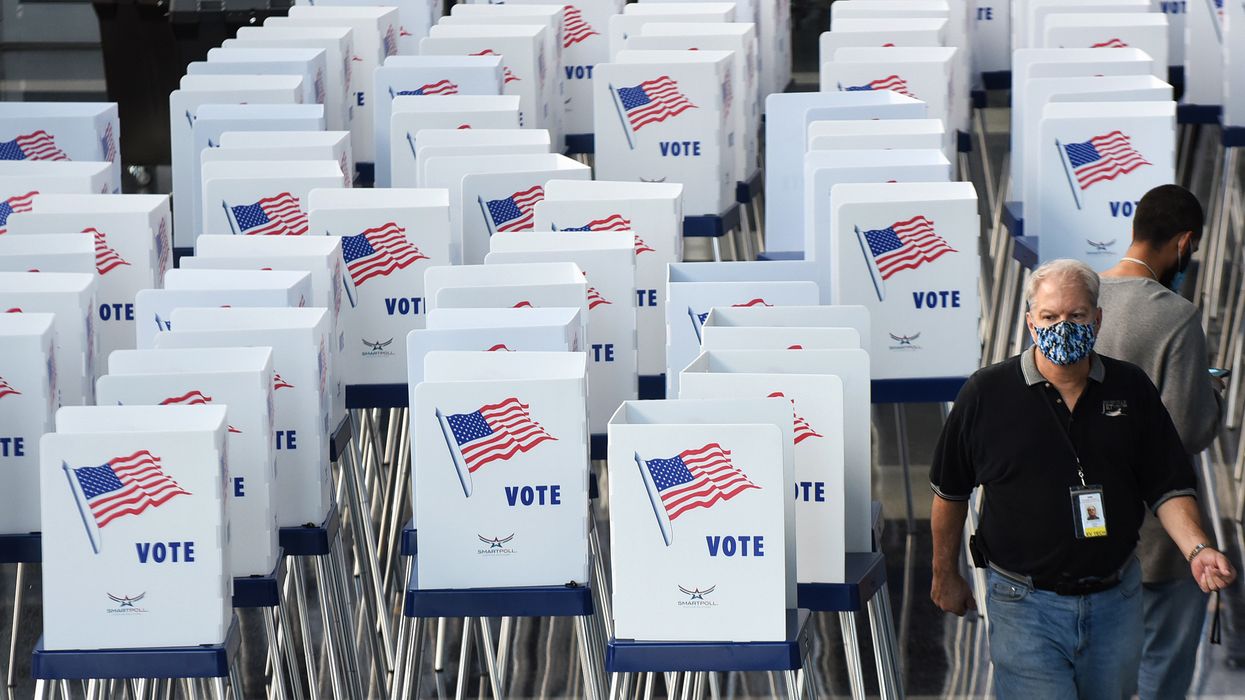 Florida elections supervisor says armed men purporting to represent Trump campaign showed up at polling place. Trump campaign says no way.