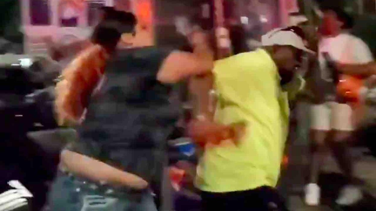 Food vendor, 65, says he was beaten after confronting woman for taking US flag from cart and demanding it be replaced with Pride flag