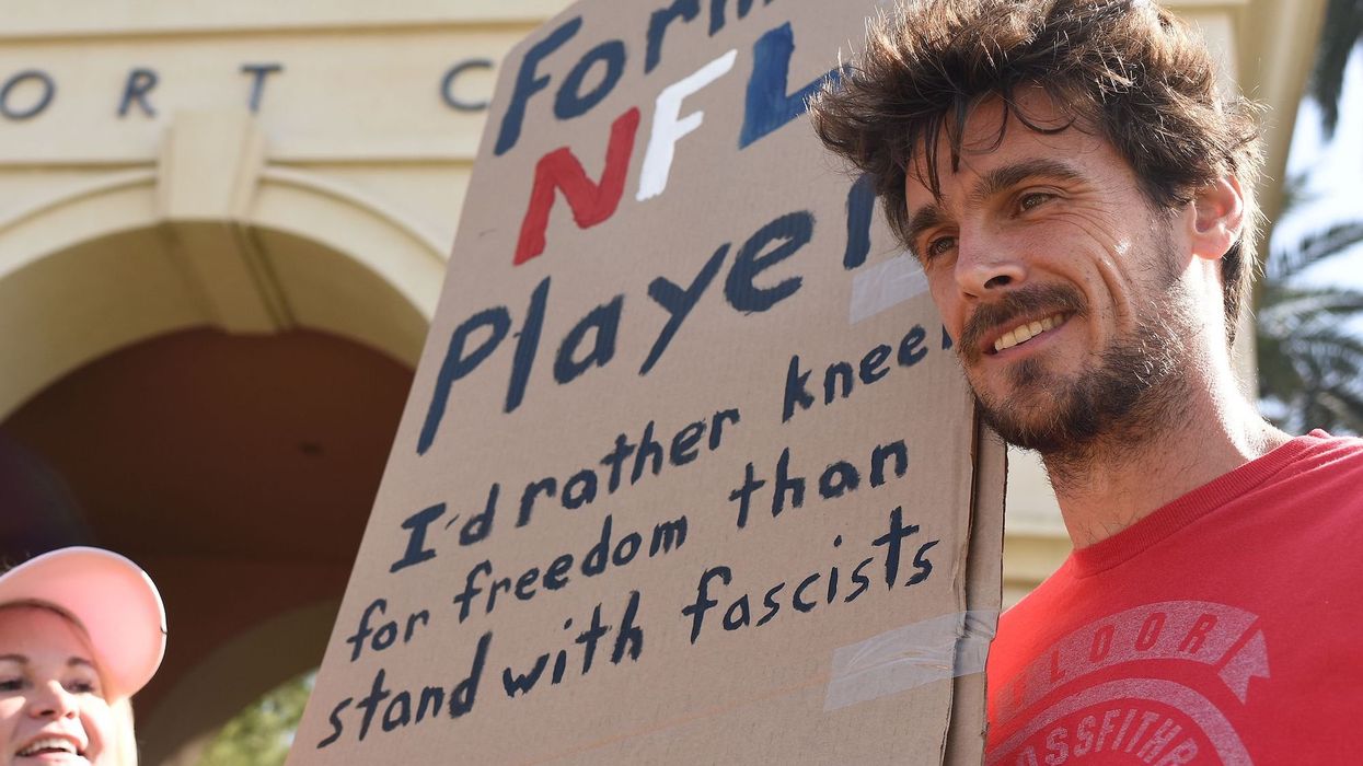 Former NFL punter gets tackled by police and arrested over 'civil disobedience' protest against MAGA plaque