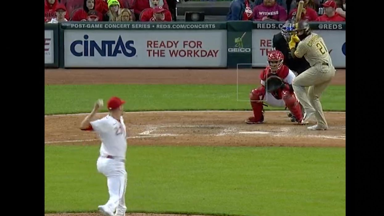 Foul ball pop-up heads into the stands — directly at a man bottle-feeding an infant. What happens next is nothing short of incredible.