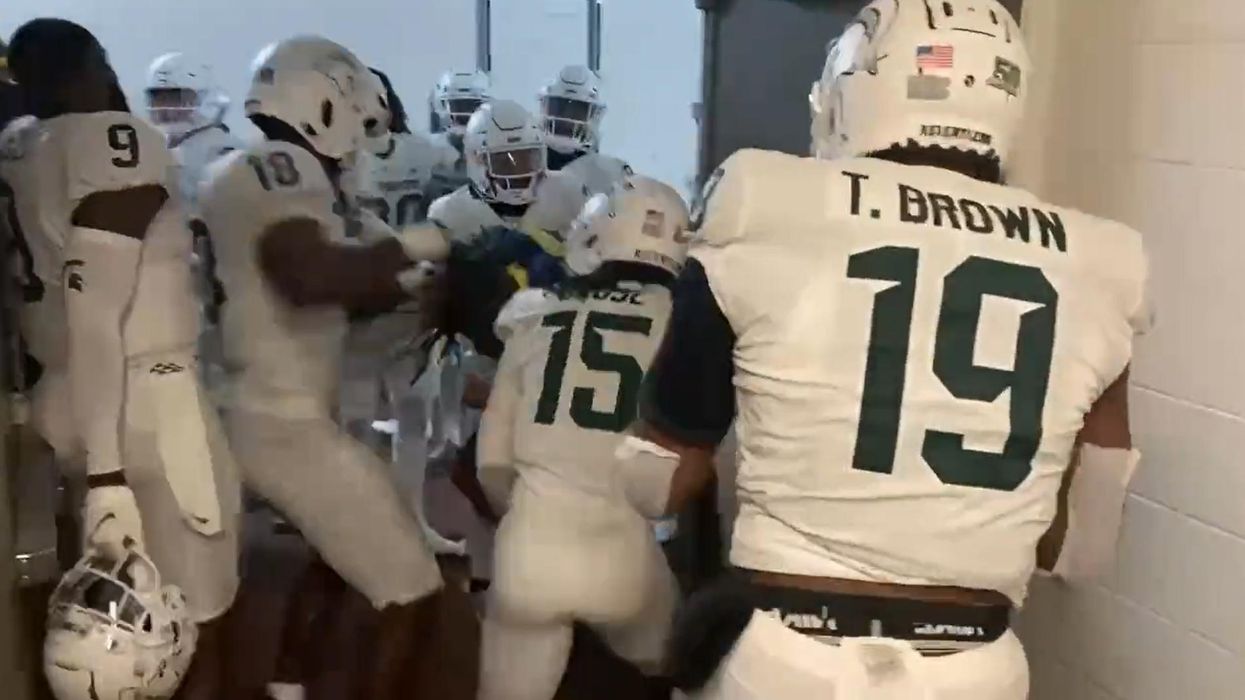 Four Michigan State football players suspended after ganging up on 2 Michigan players after game — clobbering one with a helmet; punching, kicking another in hallway