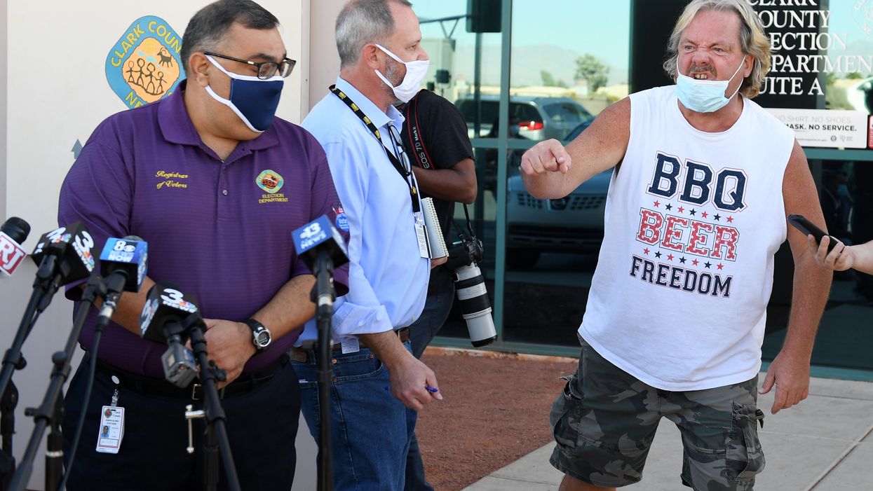 Furious activist in 'BBQ Beer Freedom' T-shirt goes viral after crashing Nevada presser: 'Biden crime family is stealing the election'