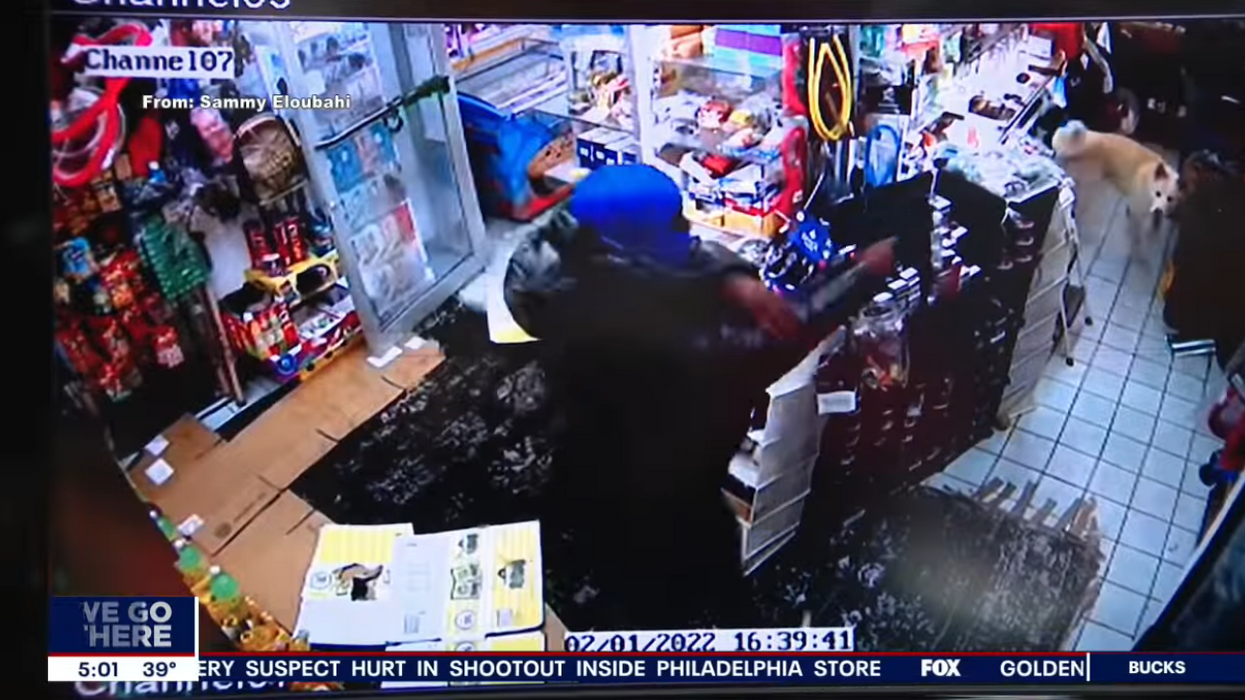 Gas station manager credits gun-wielding clerk, his dog for saving his life during intense armed robbery caught on video