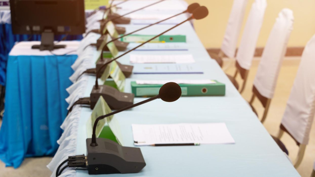 Georgia school board passes plan to arm more personnel, despite attempts from vocal opponents to shut down meeting: 'Delay the vote!'