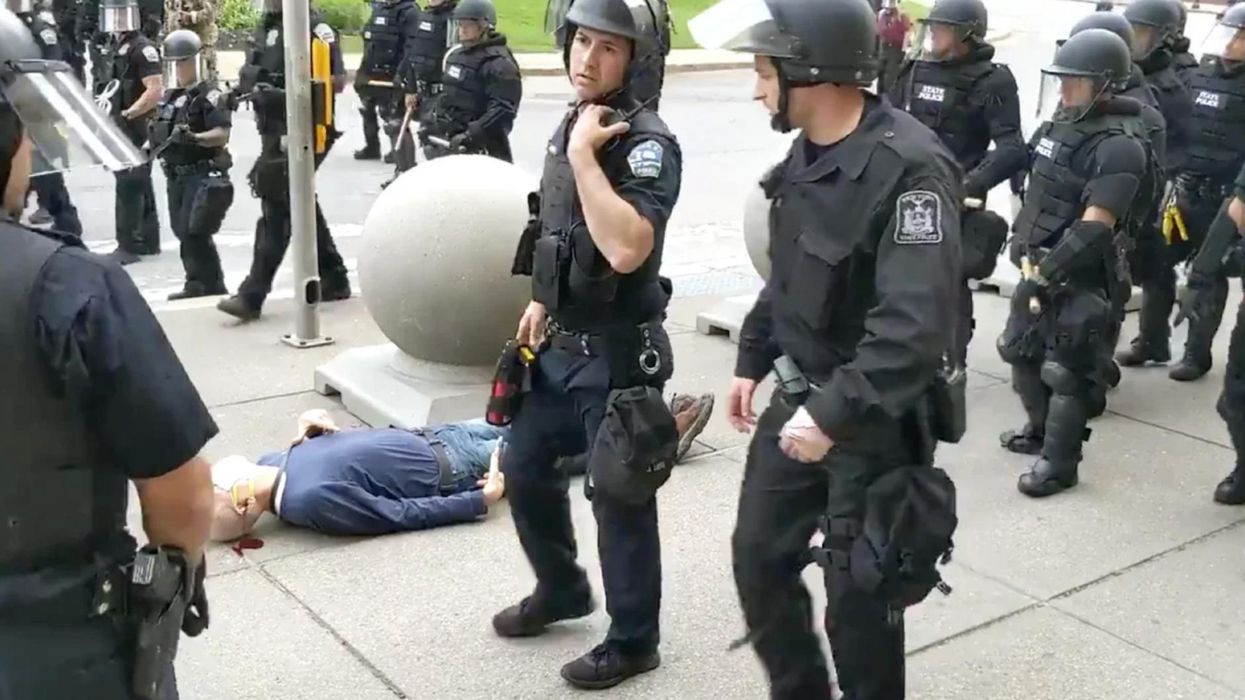 Grand jury opts not to indict officers who shoved elderly protester to the ground, leaving him with a brain injury