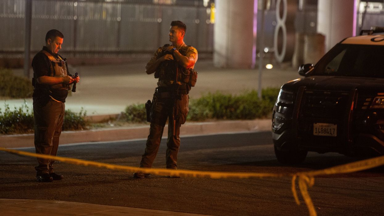 Graphic photo taken moment following shooting of 2 LA officers shows deputy shot through the jaw saving fellow cop with tourniquet and radioing for help