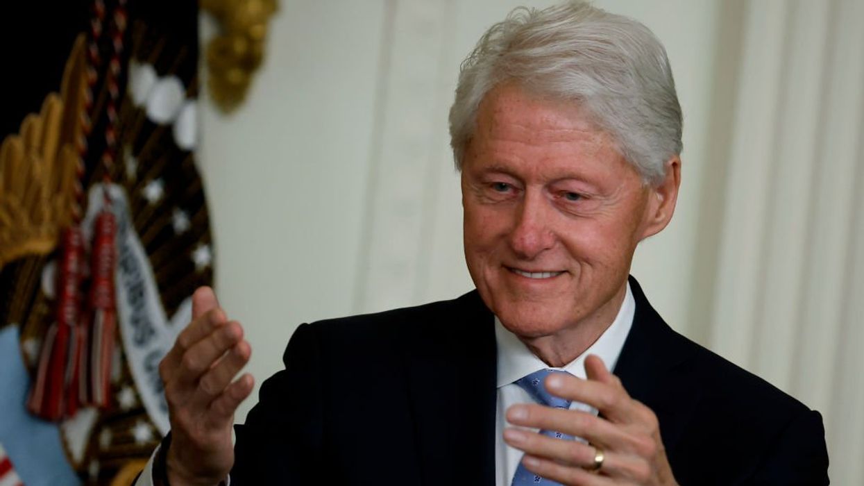 Gun WAS found near body of former Clinton aide, new report says