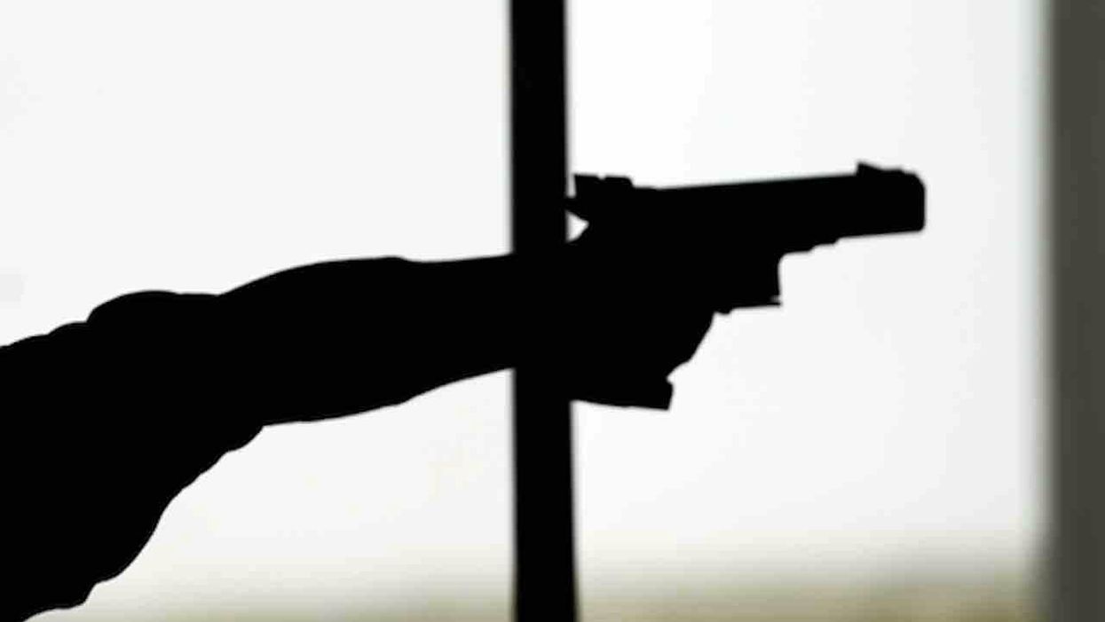 Hand with gun