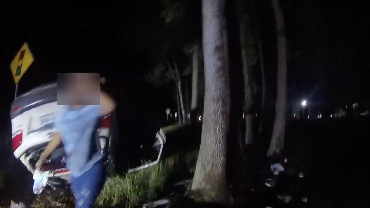 Heart-pounding video captures the moment a hero cop singlehandedly lifts overturned car to rescue a trapped mom