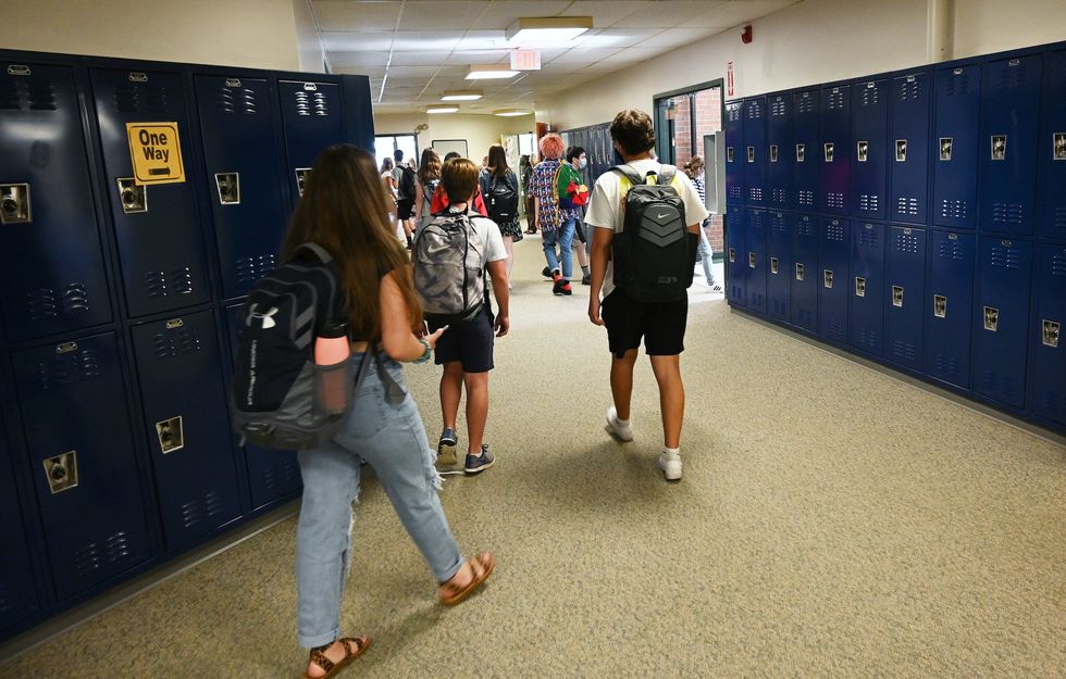 High school students face disciplinary action for posing with Nazi flag in locker room
