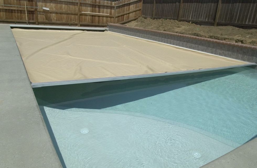 Homeowner uncovers pool for the summer and makes disturbingly gruesome find