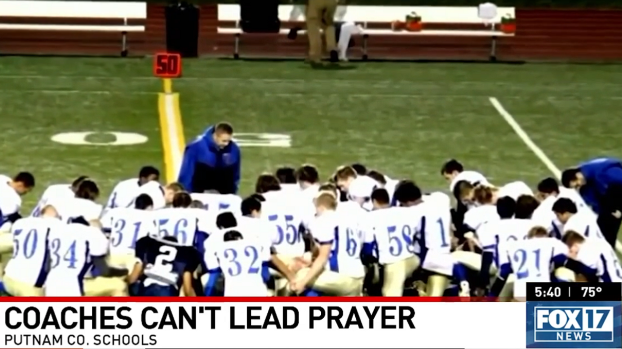 HS football team leads community in post-game prayer after school board tells coaches and teachers they no longer can: 'Satan's power was defeated tonight'