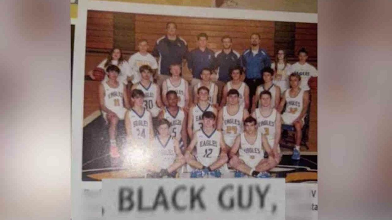 HS student listed as 'Black Guy' in basketball team yearbook photo; all other players are white and listed by name