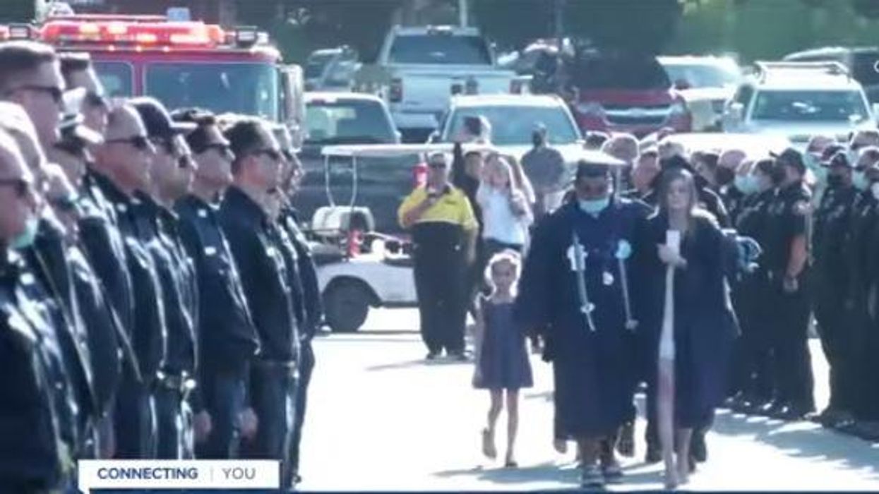 Hundreds of firefighters line entrance to graduation of slain fireman's daughter, days after his death