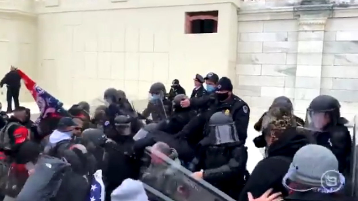 Hundreds of Trump supporters breach barricades, fight with police outside US Capitol