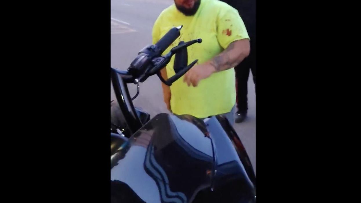 'I'm gonna knock you the f*** out!' Lone motorcyclist says protesters attacked him from behind, threatened him as they blocked Akron streets