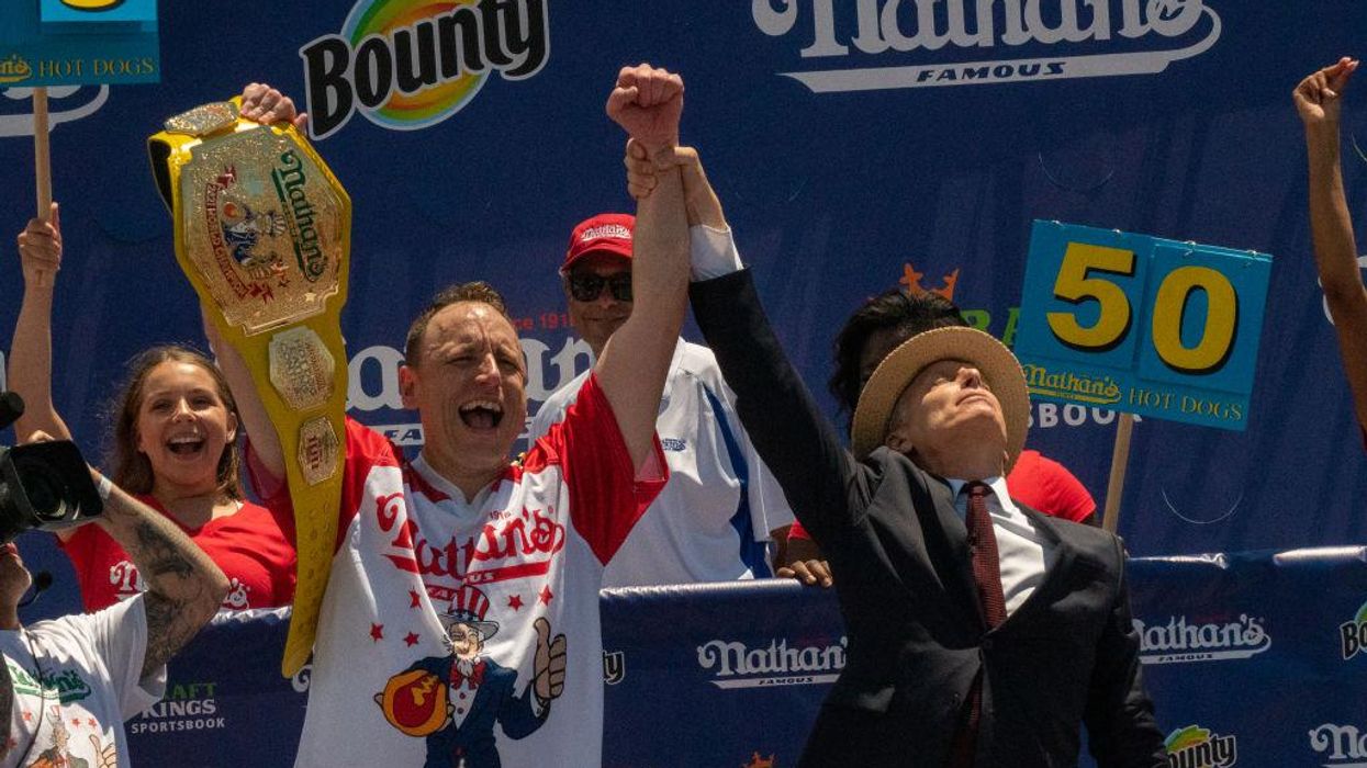 Watch: Hot dog eating champ Joey 'Jaws' Chestnut lays out idiot protester who got between him and July 4th glory