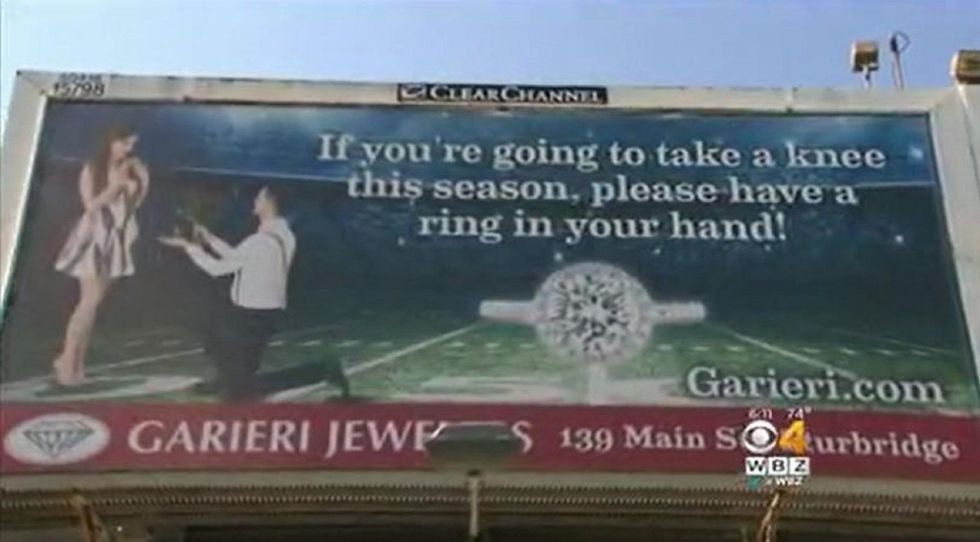 Jeweler accused of racism, threatened over 'take a knee' billboard