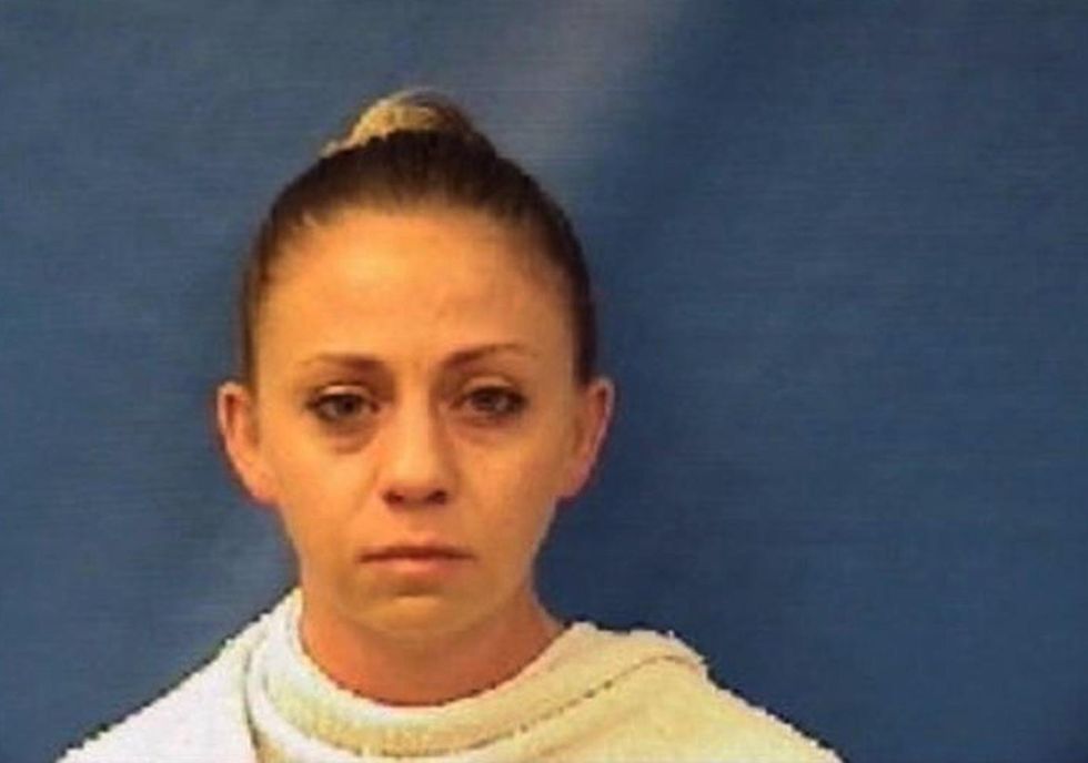Dallas police officer who killed black man after mistaking his apartment for hers arrested, charged