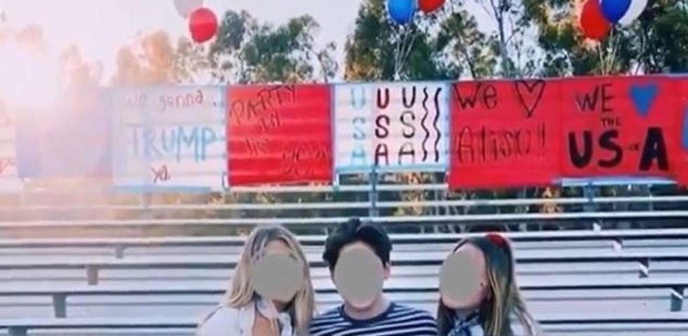 School students accused of racism for chanting 'USA' and waving pro-Trump signs at football game