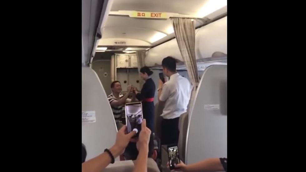 Flight attendant fired after boyfriend's midflight proposal
