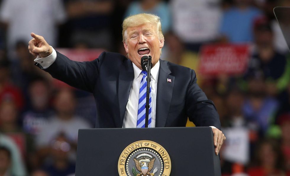 President Trump implies that he's firing Rosenstein in strong statement at rally