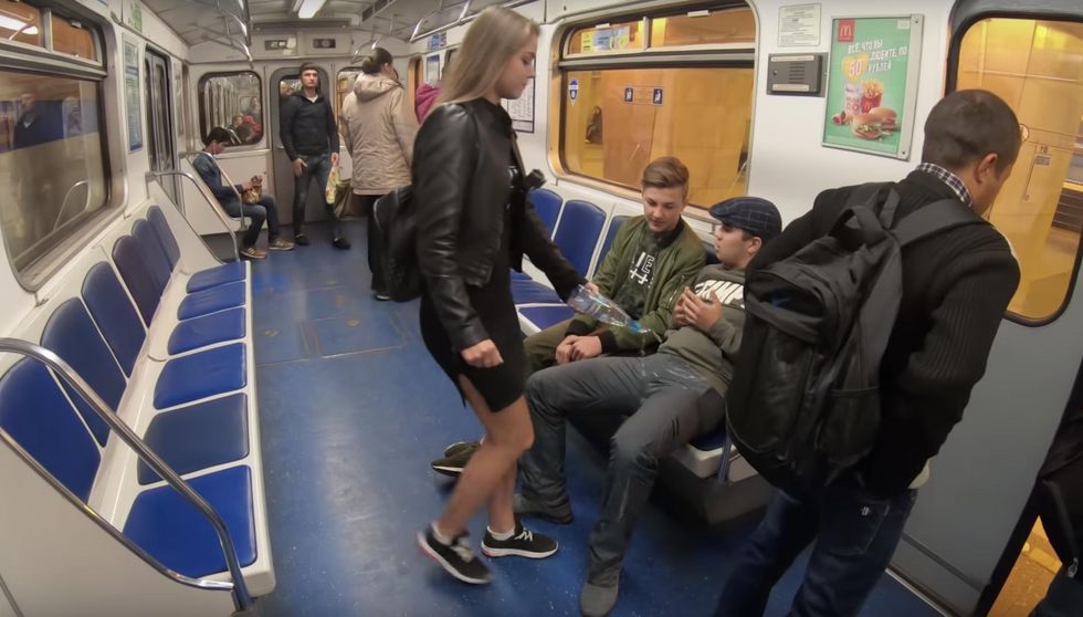 WATCH: Radical feminist pours bleach on men's crotches to combat 'manspreading