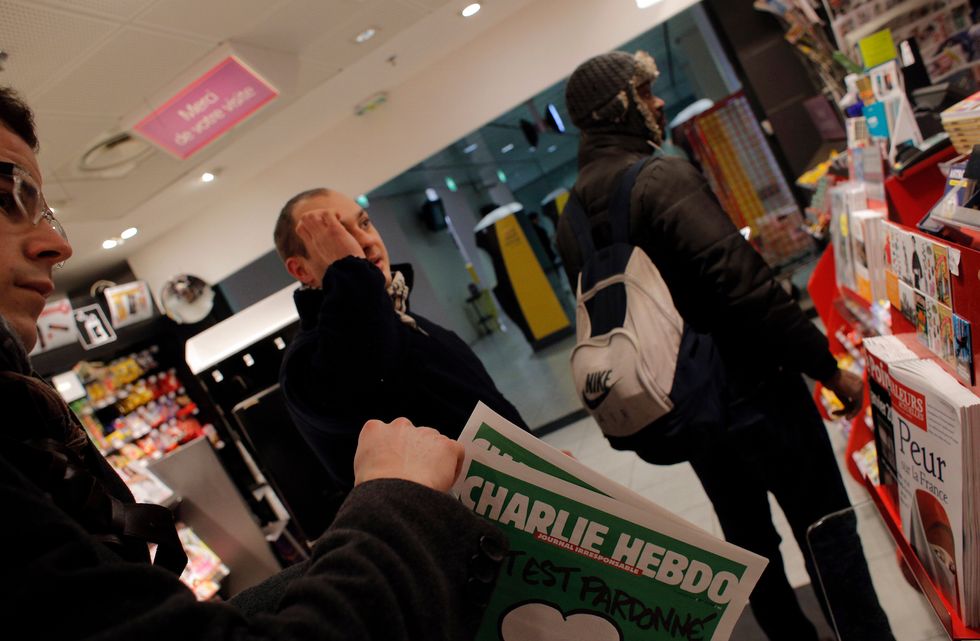 As New Charlie Hebdo Issue Depicting Muhammad Sells Out, Comic Detained