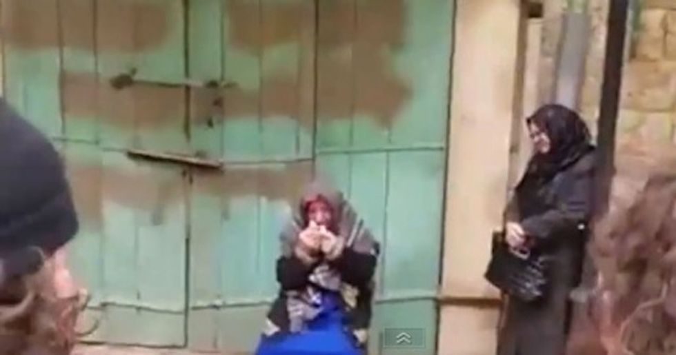Lights! Camera! Action!': Why This Photo of a Crying Palestinian Woman Is Being Called Staged