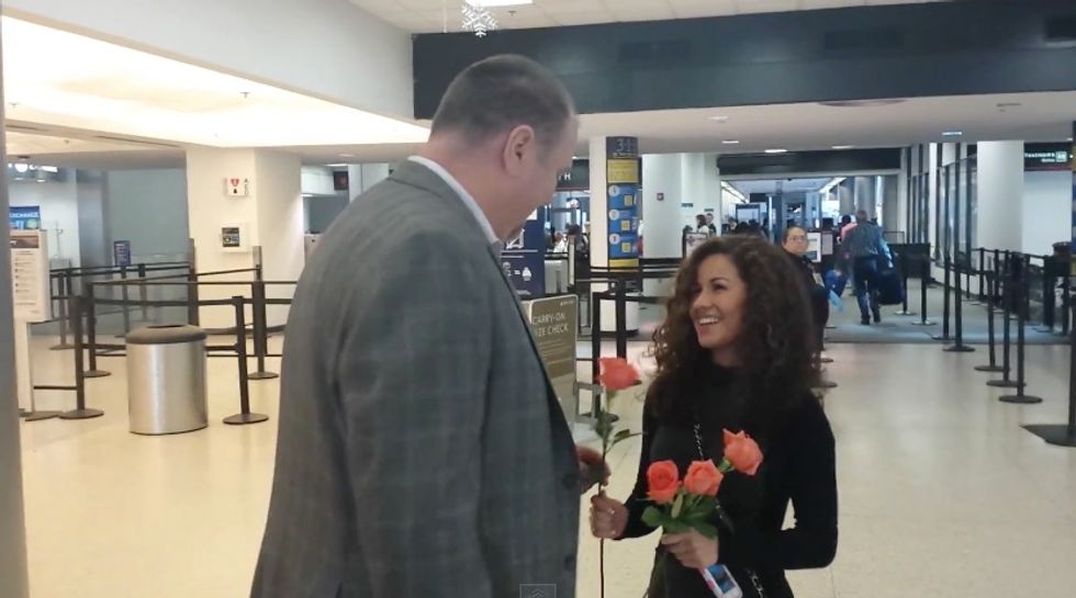 It Starts With Eight Strangers Walking Off a Plane & Handing Her Flowers...