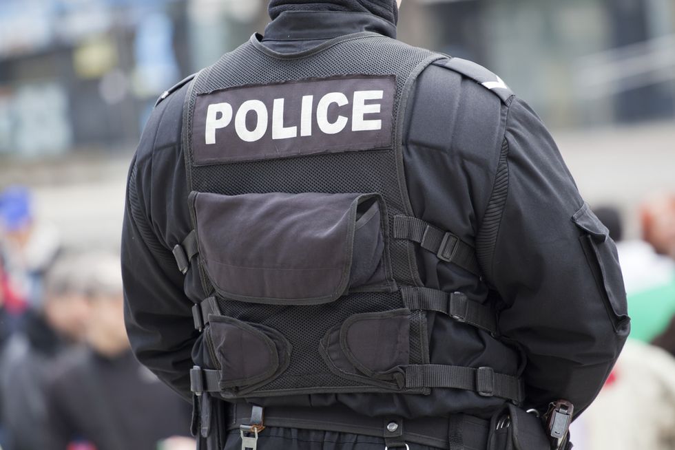 They Stormed a House to Find a Criminal, and When They Found a Scared Little Girl Inside One Cop Did Something Awesome