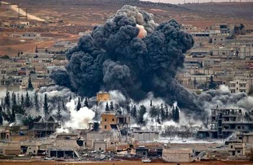 After 'Historic Victory,' a Flag Was Raised on a Hill in Key Syrian Border Town — and It Wasn't the Islamic State's 