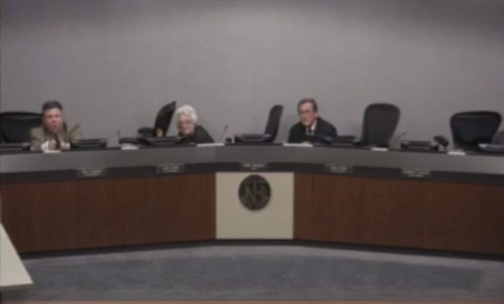 Video: Barrage of Gunshots Ring Out During Routine City Council Meeting — and One Council Member Is Prepared