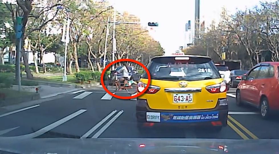 Video: How the Heck Did This Woman on a Bike Survive Being Hit by a Car?