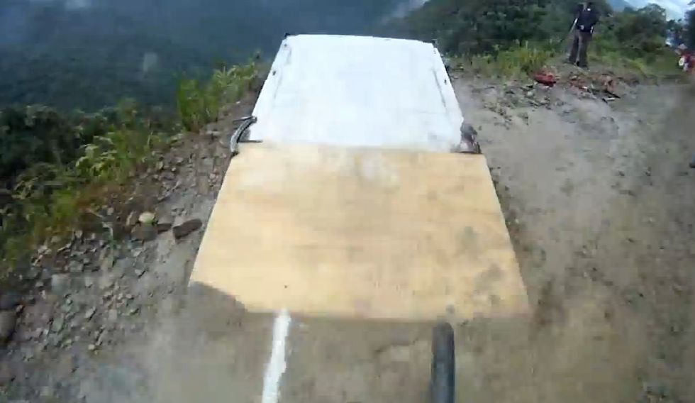 Bike Rider's Video Camera Captures 'Bolivian Death Road' Base Jump From His Vantage Point. Get Ready to Wince.