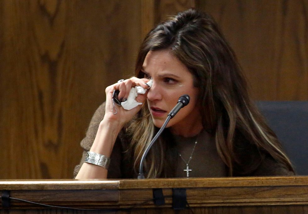 PHOTOS: Without Saying a Word, 'American Sniper' Chris Kyle's Widow, Taya, Honors Husband in Court