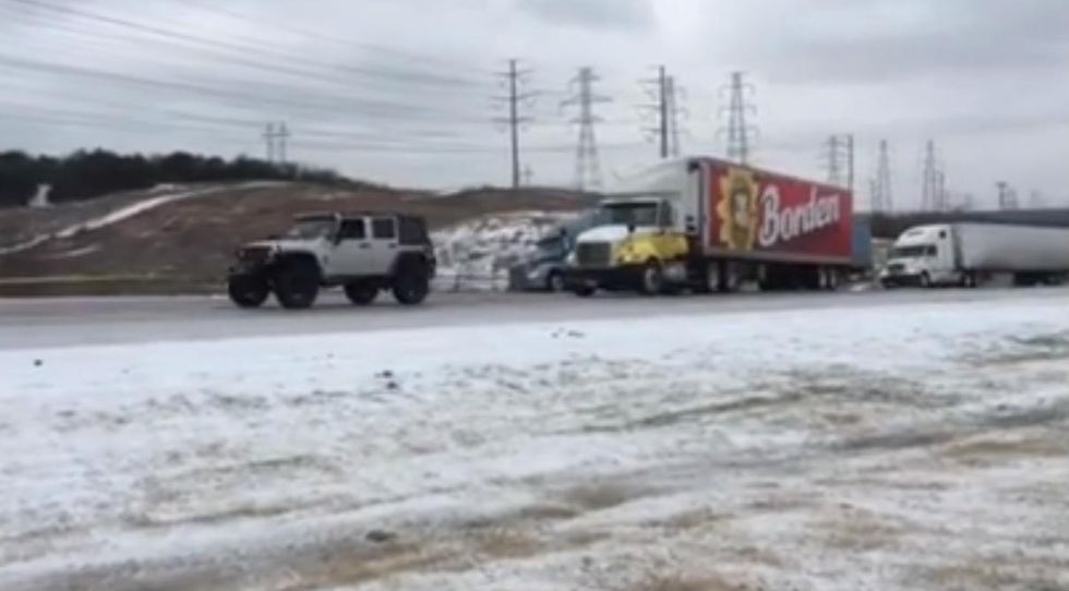 Video: Watch an Army of Jeeps Rescue Massive Semi-Trucks During Icy Conditions