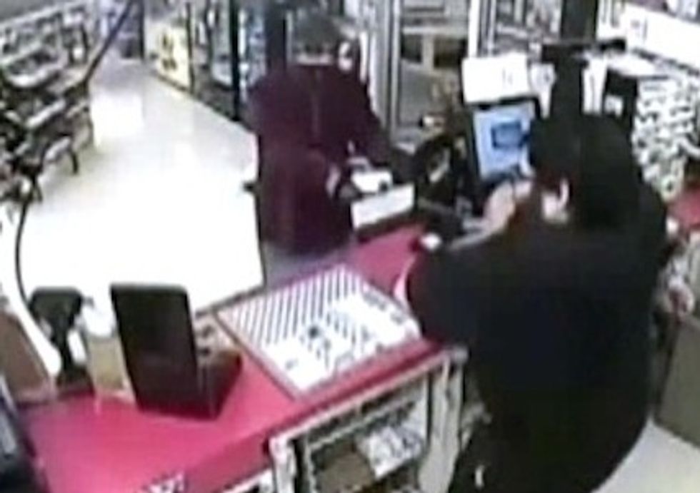 Flame-Throwing Robbery Suspect' Caught on Camera Dousing a Gas Station Clerk With Lighter Fluid