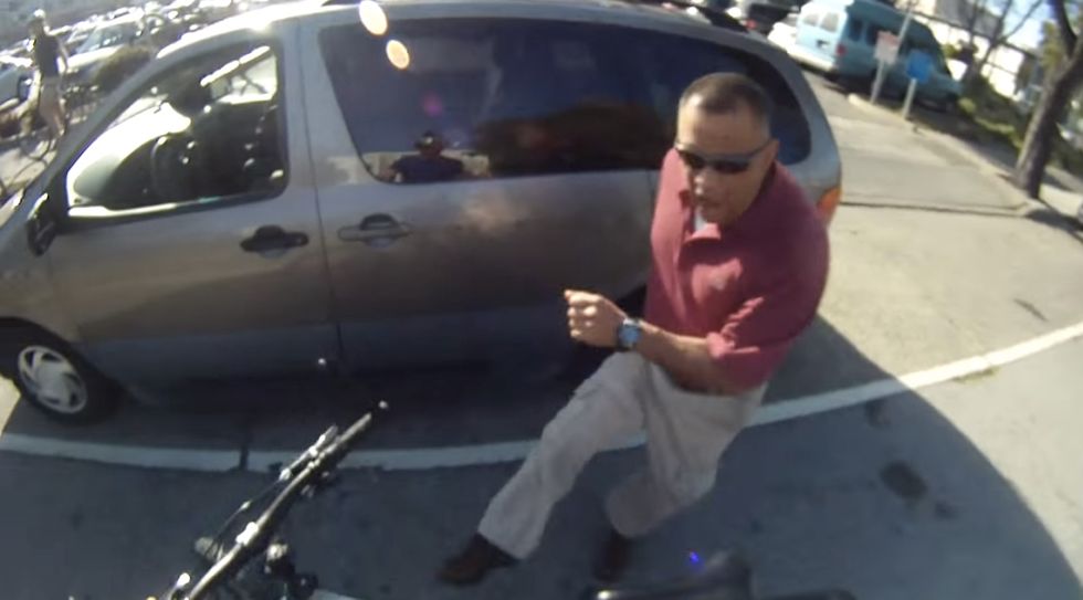 There's a Child in His Minivan and He Just Ran a Bike Off the Road. Think You Can Predict How He'll React? Watch the Video.
