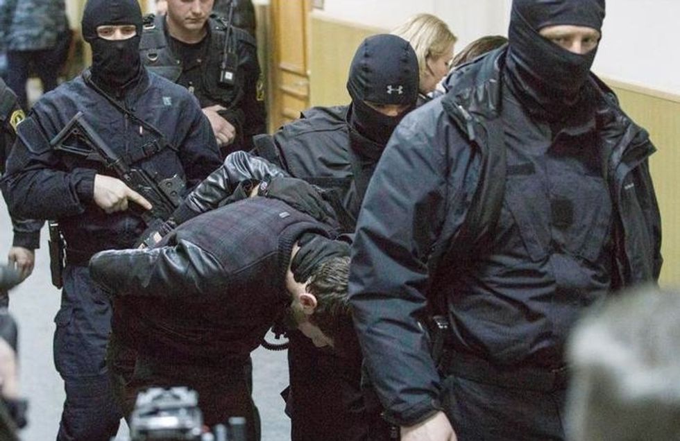 Two Men Charged, Three Held in Jail and One Has Blown Himself Up in Russian Murder Case