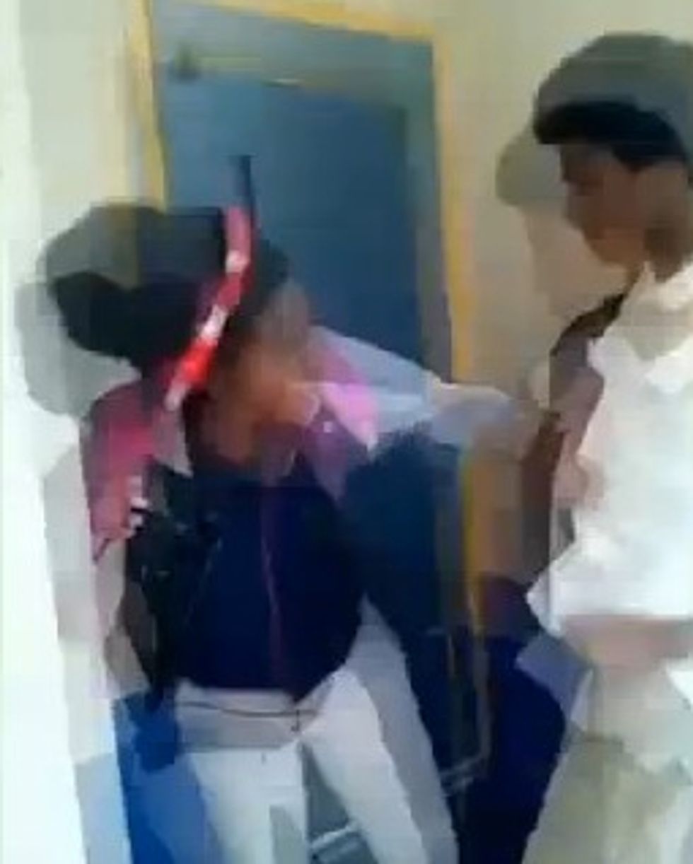 Cellphone Video Shows a Male Student Throw the First Punch at a Female in Violent Fight