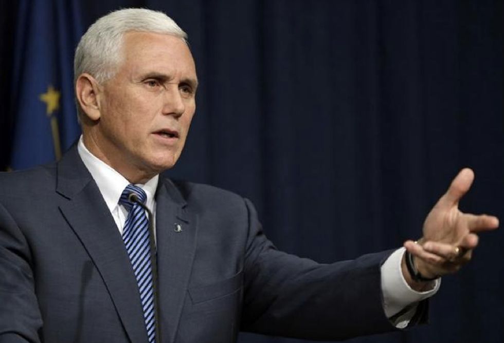 Indiana Gov. Mike Pence Signs Controversial 'Religious Freedom' Act Into Law as Critics Issue Discrimination Warnings