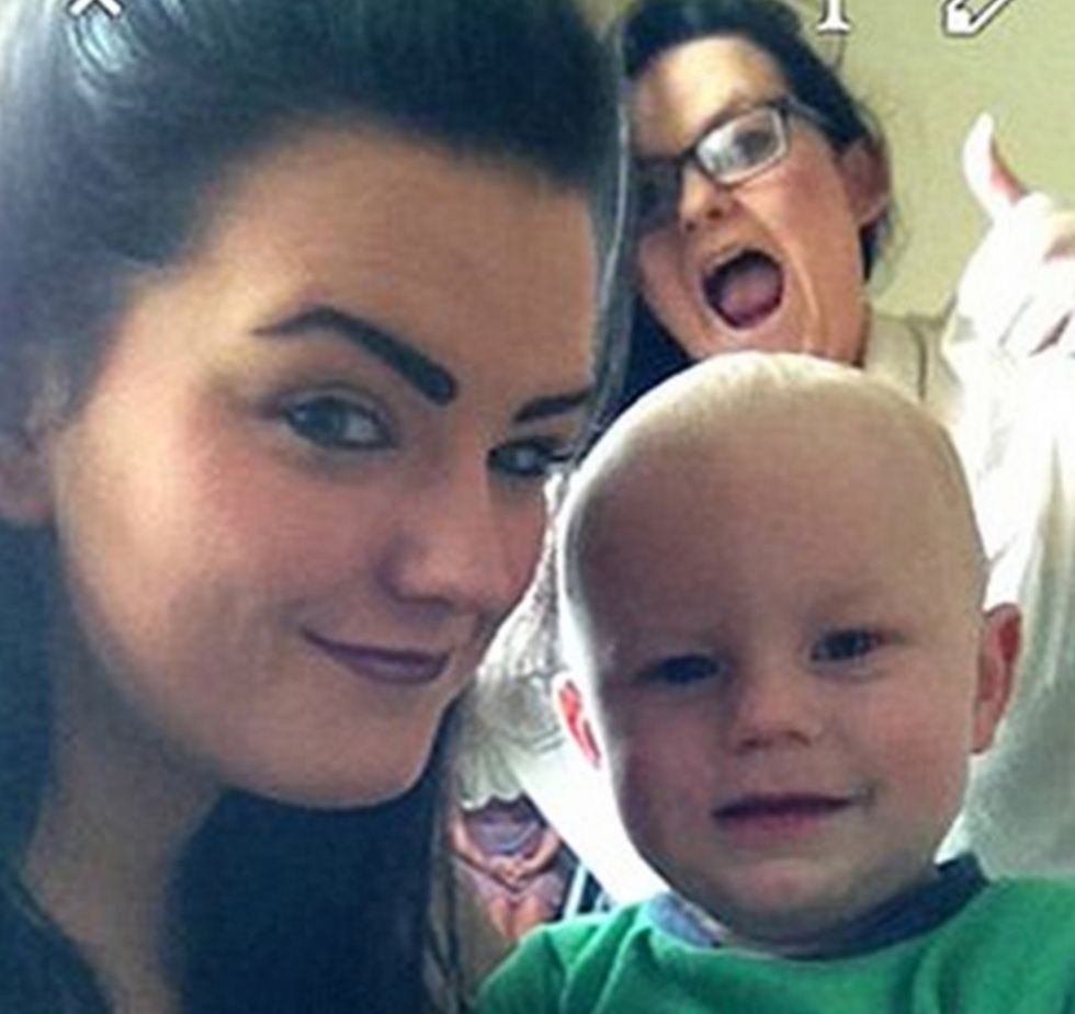 Do You See the Creepy Figure This Woman Noticed in the Background After Taking Picture With Her Nephew?