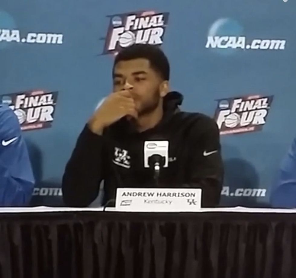 A Reporter Asks a College Basketball Player About His Rival. The Player Puts His Hand Over His Mouth, but the Mic Still Picks Up the Profane Thing He Says in Response.