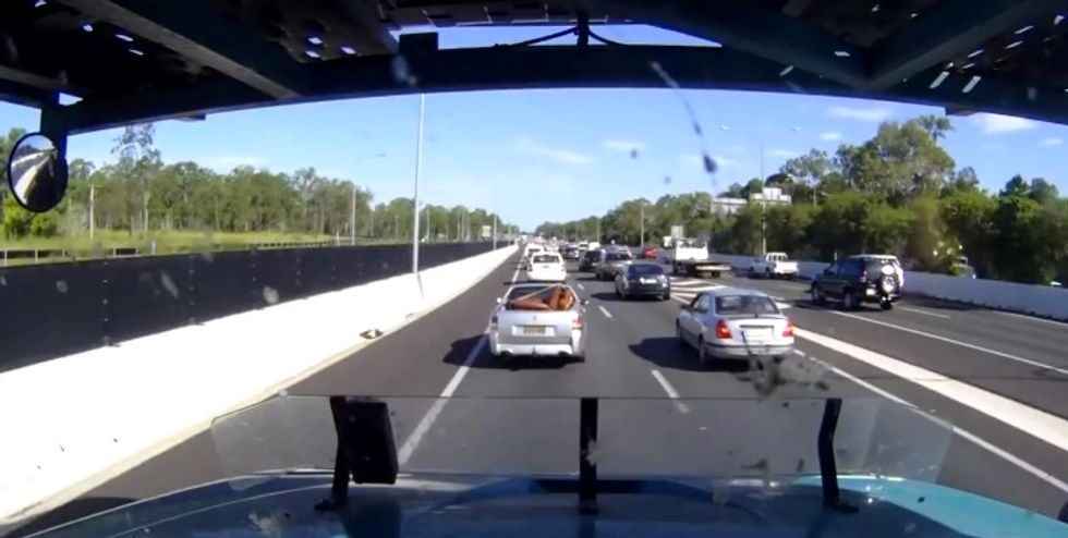 Driver Gets Big Dose of Instant Karma After Using Shoulder Lane to Cut Ahead of Traffic