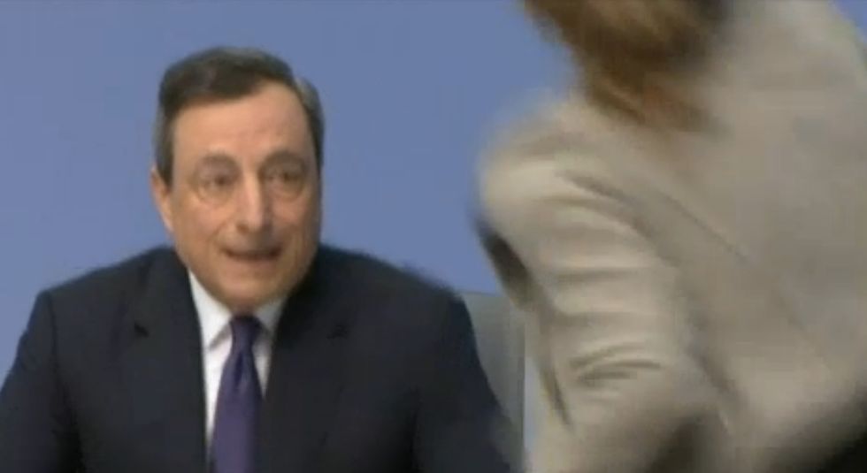 One of the World's Most Powerful Bankers Was Just Bum-Rushed by a Woman Who Jumped on His Table and Started Throwing Stuff