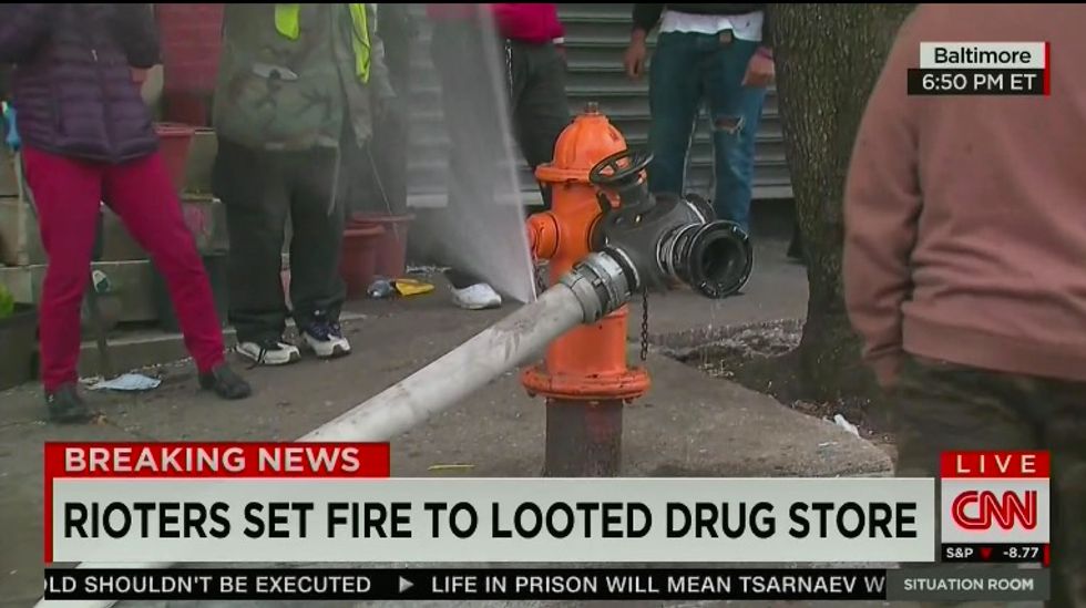Man Punctures Fire Hose As Firefighters Attempt to Put out CVS Fire in Baltimore