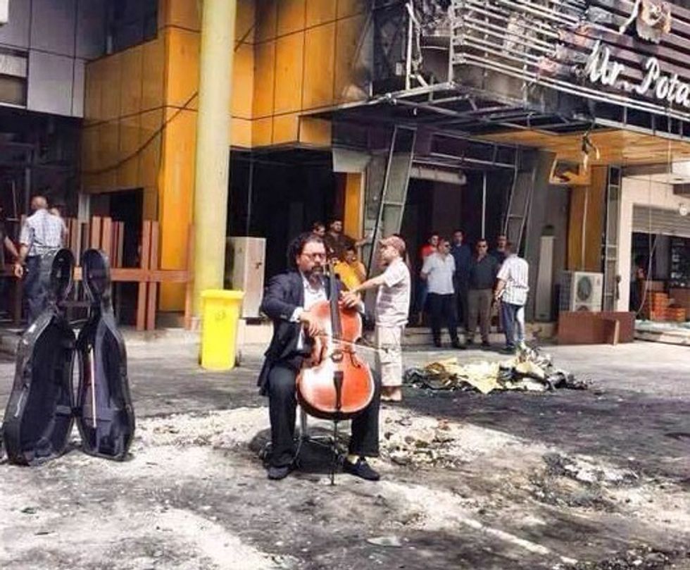 Iraqi Musician Defies Terrorists With Haunting Cello Solo at Car Bombing Site
